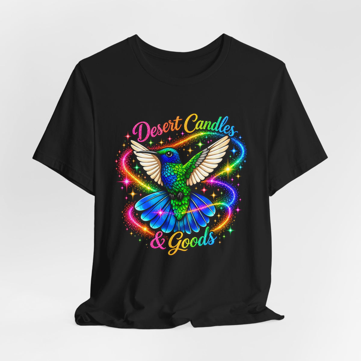 Hummingbird Rainbow Logo Tee — "Desert Candles & Goods" Colorful Graphic T-Shirt