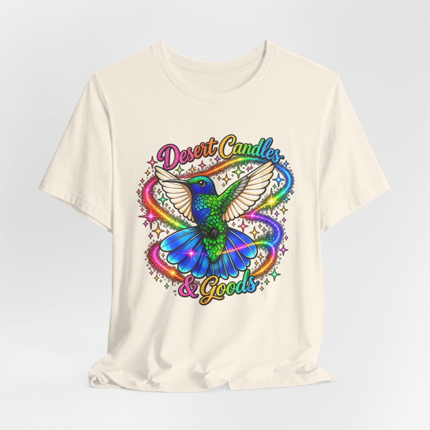 Hummingbird Rainbow Logo Tee — "Desert Candles & Goods" Colorful Graphic T-Shirt