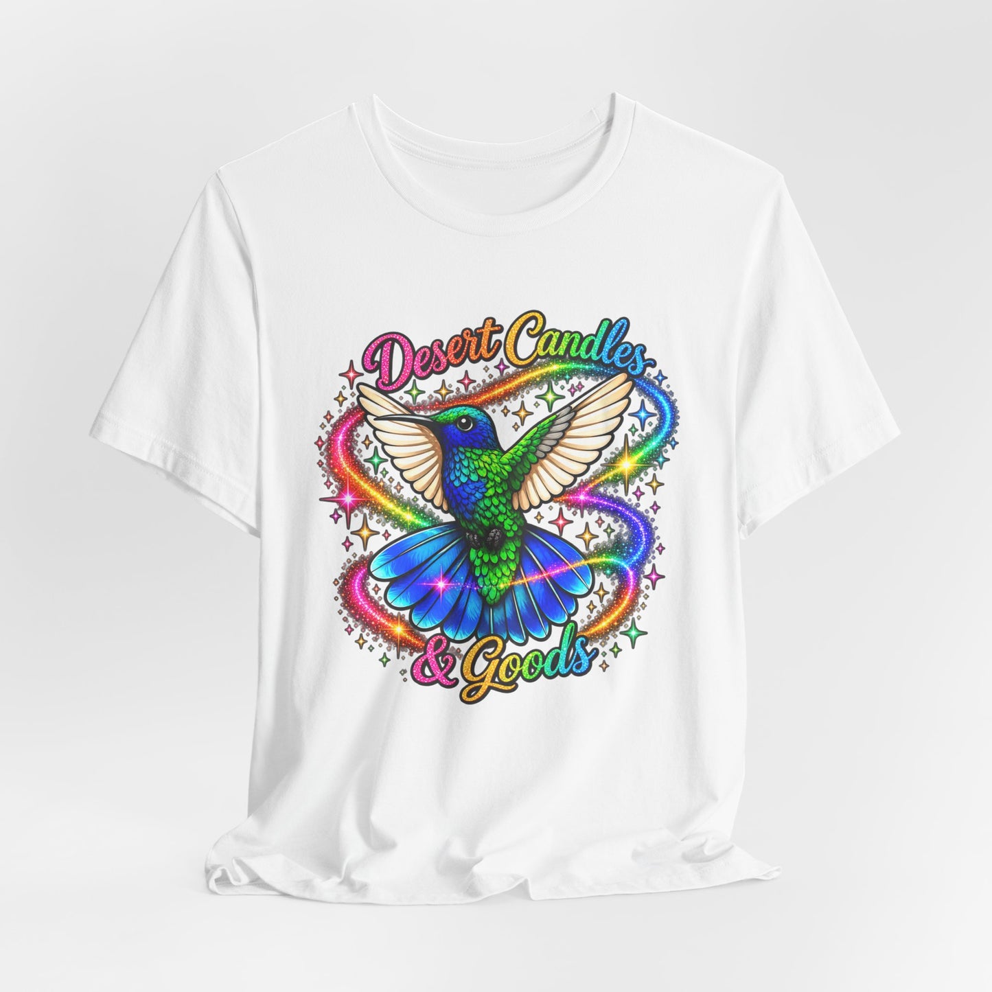 Hummingbird Rainbow Logo Tee — "Desert Candles & Goods" Colorful Graphic T-Shirt